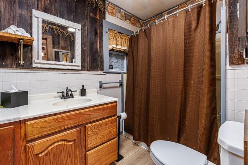 a bathroom with a sink and a shower at The Old Homestead in Roulette