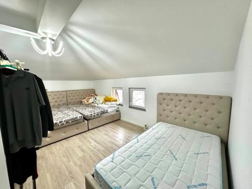 a small bedroom with a bed at Modern Penthouse with Unbeatable Panoramic Views in Peje