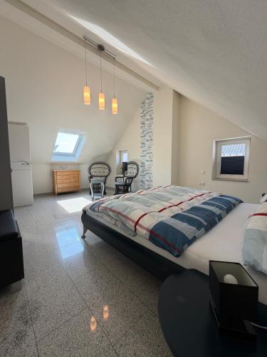 a bedroom with a large bed and a tv at Burgblick in Bernkastel-Kues