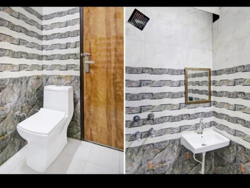 a bathroom with a toilet and a sink at Tara Regency Hotel in Shimla