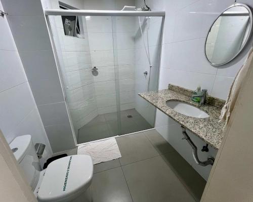 a bathroom with a shower and a toilet and a sink at Edifício Madrid | Ayrton Senna in Toledo
