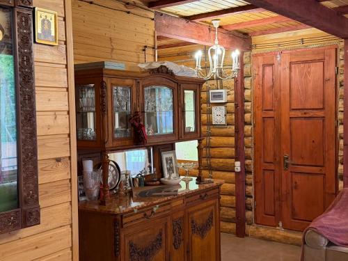 a kitchen with a sink and a wooden wall at Villa Shoda in Oni