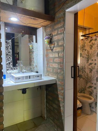a bathroom with a sink and a mirror at Complejo el cordobes in Albardón