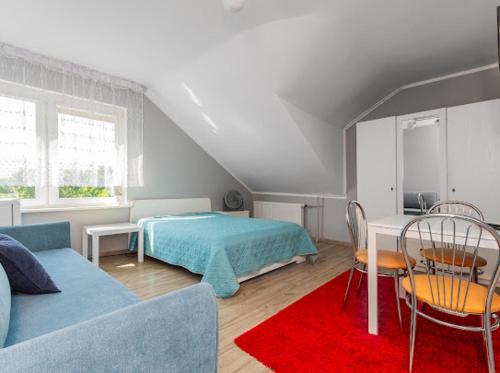 a bedroom with a bed and a table and chairs at Martina in Stegna