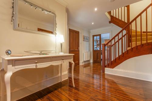 a bathroom with a sink and a mirror at Links Lodge - Blacklaws Steading in Anstruther