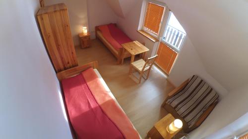 an overhead view of a room with a bed and a table at Dom W Rzepiskach in Rzepiska
