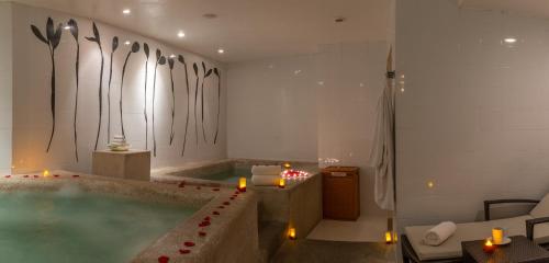 a bathroom with a jacuzzi tub in a room at Pueblo Bonito Pacifica Golf & Spa Resort - All Inclusive - Adults Only in Cabo San Lucas