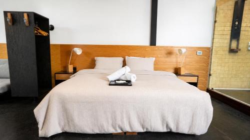 a bedroom with a bed with a teddy bear on it at Casa Caballero y Osio in Querétaro