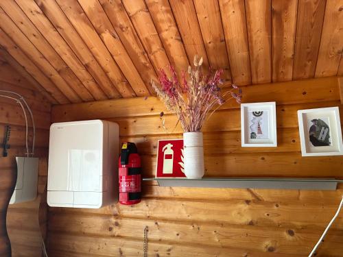 a wall with a shelf with a coffee machine at Naturunterkunft Leonberg in Leonberg