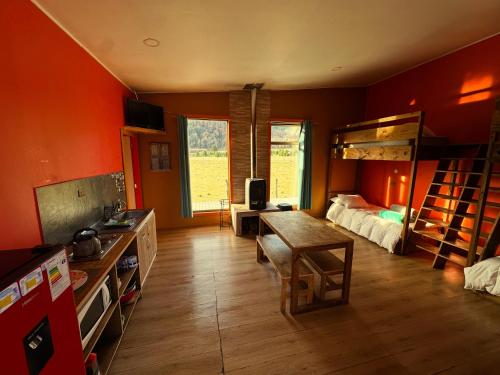 a room with a bedroom with a bunk bed at La Alea Malalcahuello in Malalcahuello
