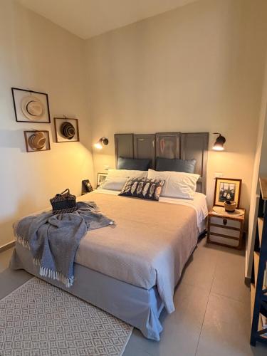 a bedroom with a large bed in a room at Amatacasa Villa Rosa in Melfi