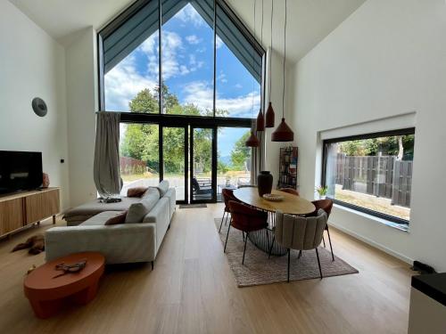 a living room with a couch and a table at Casa Verta in Skrad