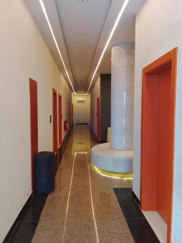 a hallway of a hospital with a bed in the middle at One One B Luxury Hotel in Asaba