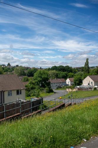 a view of a town with houses and a road at Ilsyn Grove in Brislington