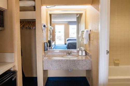 a bathroom with a sink in a room at Hatteras Island Inn in Buxton
