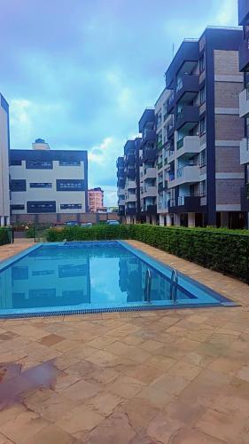 a swimming pool in the middle of a building at Amaziah apartment Mimyhomes in Nairobi