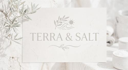 a white table with a sign that reads terra and salt at Terra & Salt in Bibinje