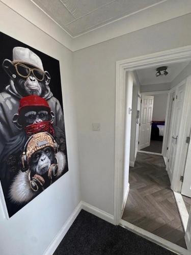 a large painting on the wall in a hallway at Sea-View Luxury Apartment sleeps 5 - Pet Friendly - Fast WiFi - Off Street Parking - Contractors Dream!!! in Sheerness