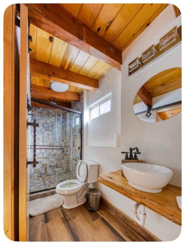 a bathroom with a toilet and a sink at Casa Nautilis in San Miguel