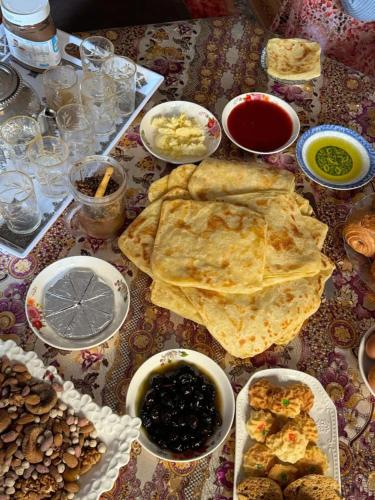 a table topped with lots of different types of food at Gite Ain Bechar in Taza