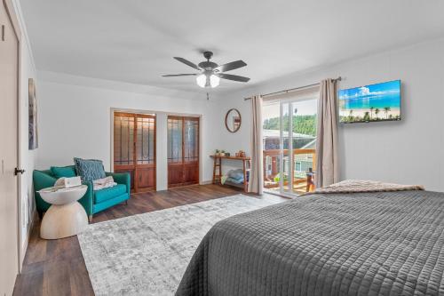 a bedroom with a bed and a blue couch at Terimore Lodging by the Sea in Tillamook