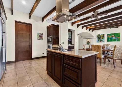 a kitchen with a large island in a room at Resort Villa Pool Golf & Beach Access in Playa Avellana