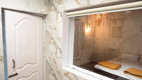 a bathroom with a shower with a bed in it at Jambhul Nest studio Pool & Rainforest Escape in Dhamni