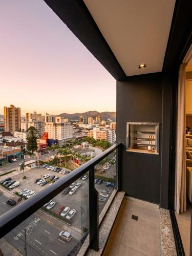 a balcony with a view of a city at Apt Premium com Vista Panorâmica e Lazer Completo in Joinville