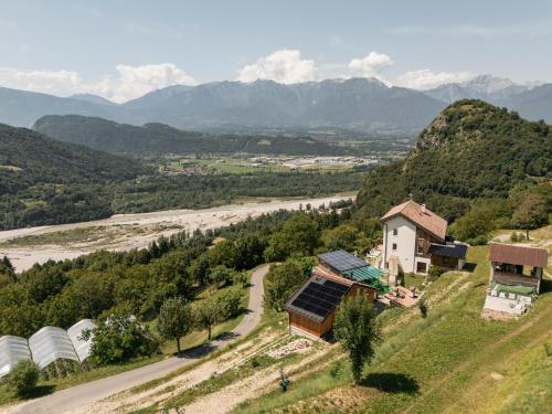 an aerial view of a farm with mountains in the background at Agriturismo Saettà in Lentiai