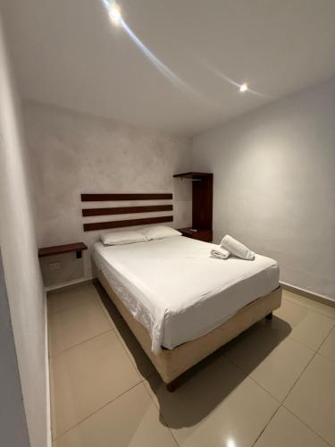 a bedroom with a large bed in a room at Casa Villa Leo in Cancún