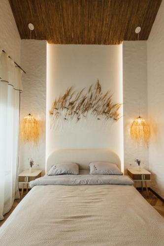 a bedroom with a bed and two tables at Villa Pelahia in Slavske