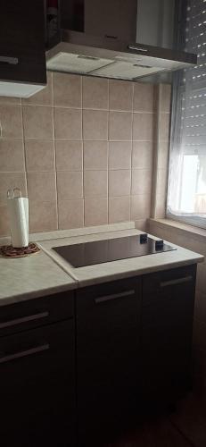 a kitchen with a sink and a counter top at SIM residence in Maniago