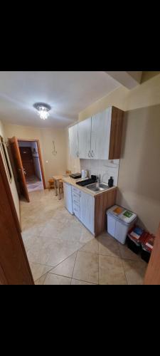 a kitchen with a sink and a counter top at Gościniec Joanna in Rajgród