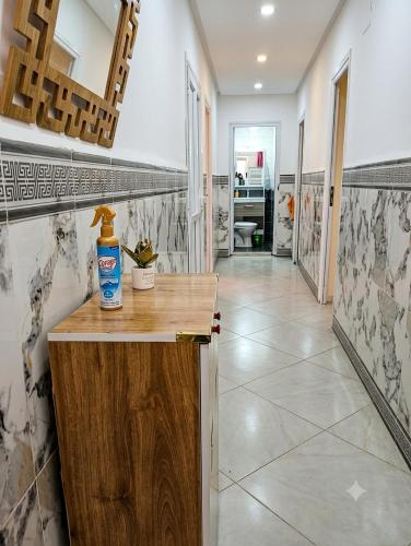 a kitchen with a counter with a bottle on it at Dar mouni relax in Oran