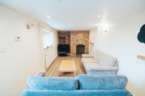 a living room with a couch and a table at The Welsh Welcome in Pen-y-groes