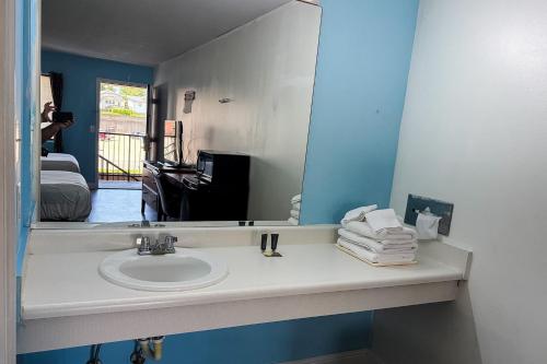 a bathroom with a sink and a mirror at Mountain View Inn Irvine Near Richmond KY in Irvine