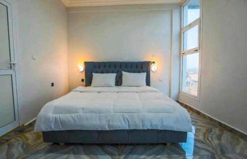 Llit o llits en una habitació de NADINE HOME iv
