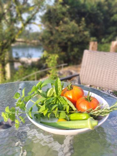 a plate of vegetables sitting on a table at Kingfisher Lodge in Shodoshima