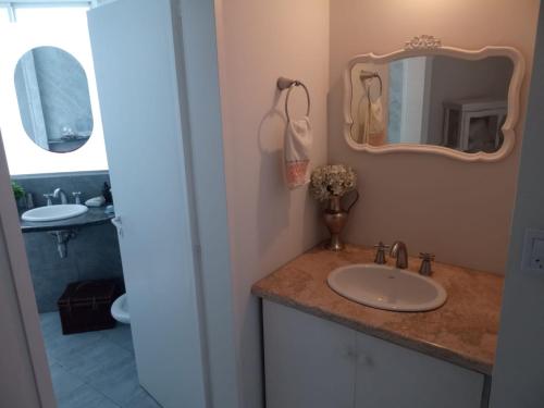 a bathroom with a sink and a mirror at Quinta Un Sueño Junin in Junín