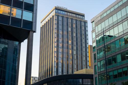 a tall building in the middle of some buildings at INNSiDE by Meliá Liverpool in Liverpool