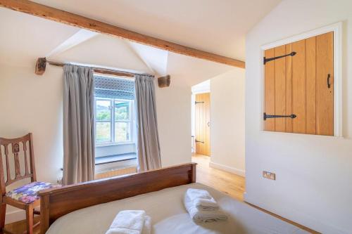 a bedroom with a bed and a window at 2 Bed in Ambleside oc-lr059 in Ambleside