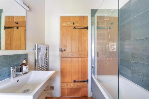 a bathroom with a sink and a shower at 2 Bed in Ambleside oc-lr059 in Ambleside