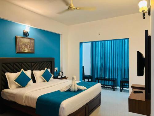 Säng eller sängar i ett rum på Hotel Cloud Coorg