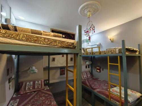 two bunk beds in a room with two beds at Third eye view hotel and hostel in Jaisalmer