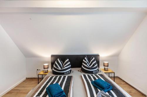 a bedroom with a large bed with blue pillows at Andrea Vacation Home in Döbeln