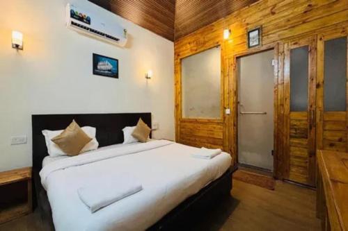a bedroom with a large bed in a room at FabHotel Maitree Beach Resort in Arambol