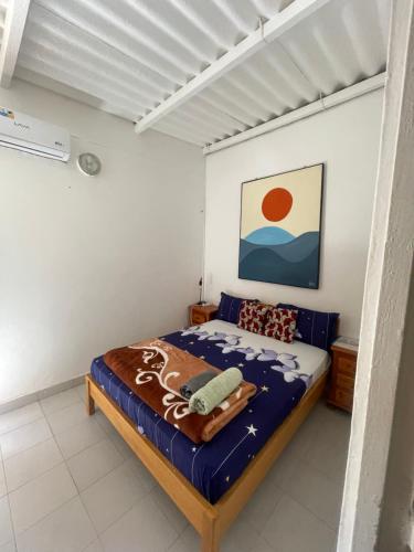a bedroom with a bed in a room at Malika Surf House in Dakar