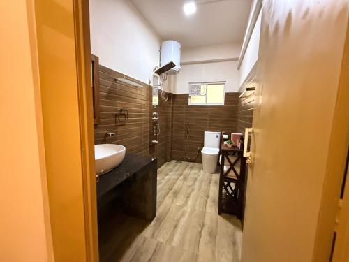 a bathroom with a sink and a toilet at Crown Valley Boutique Lifestyle Hotel, Ella in Ella