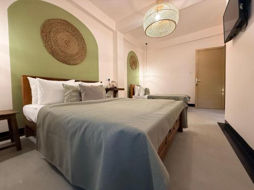 a bedroom with a large bed in a room at Crown Valley Boutique Lifestyle Hotel, Ella in Ella