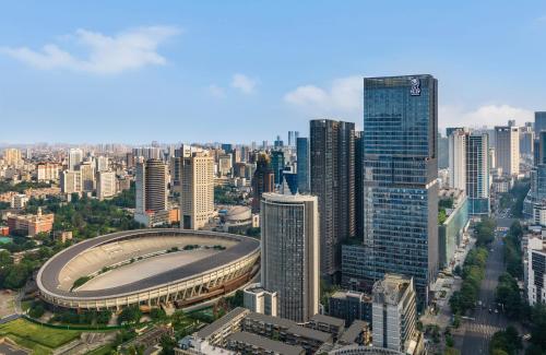 an aerial view of a city with a stadium at The Ritz-Carlton, Chengdu in Chengdu